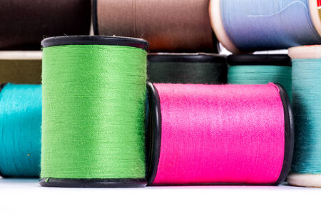 Many colorful threads on white background