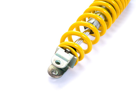 Yellow Shock absorber. isolated on white backgroundの写真素材