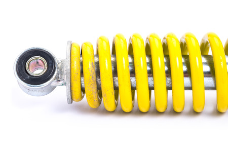 Clolse up Yellow Shock absorber. isolated on white backgroundの写真素材