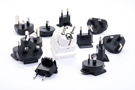 group of black and white universal adapter isolated on white backgroundの写真素材