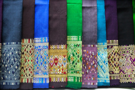 stack of traditional colourful sarong in the shop. for a background
