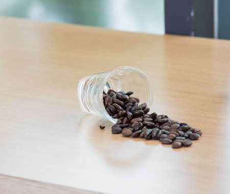 Glass full of coffee beans on the table
