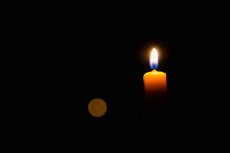 Yellow Candle in dark Backgroundの写真素材
