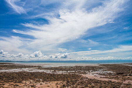 Stone beach in cloudy dayの写真素材