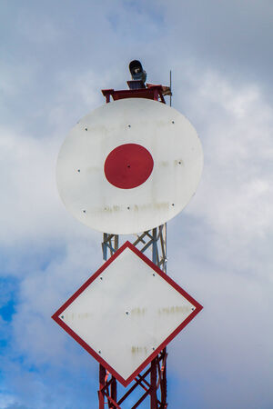 Warning signs for boats beware the submarine power line under waterの写真素材