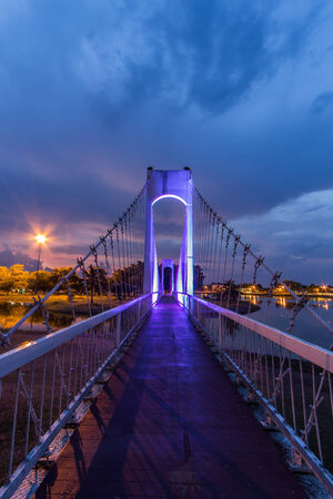 The metal rope bridge  in the park at twilight timeの写真素材