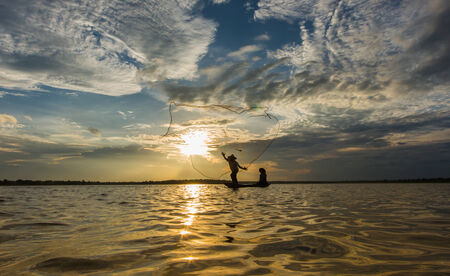 Fishermen fishing by fishnetの写真素材