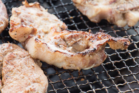 Were sliced roast pork Positioned on a wooden cutting boardの写真素材