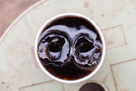 Coca Cola and ice look like eyesの写真素材