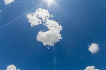 Sunlight and clouds on the blue sky in cloudy daysの写真素材