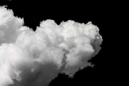 Isolated white cloud and black sky backgroundの写真素材