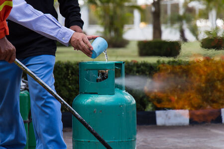 Extinguish the fire from LPG gas by waterの写真素材