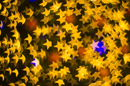 Defocused star bokeh on christmas light backgroundの写真素材