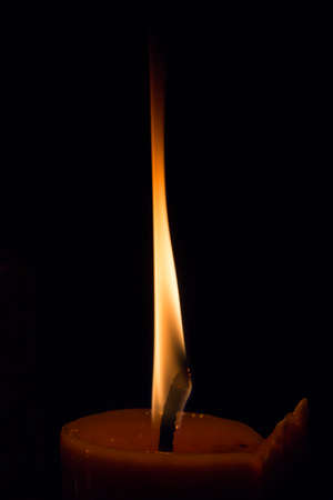 Candle flame at night closeupの写真素材
