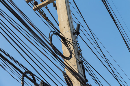 Fiber-optic communication systems. With the closure and loop  on power poles.の写真素材