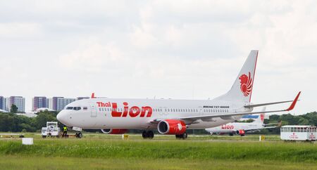 UDONTHANI, THAILAND - AUGUST 12, 2015:Air plane Boeing 737-900ER of Lion Air Employees checking the...