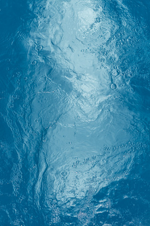 Beautiful pattern of blue water reflecting the sun.の写真素材