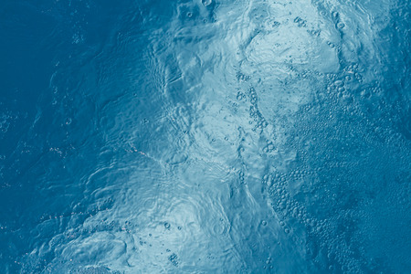 Beautiful pattern of blue water reflecting the sun.の写真素材