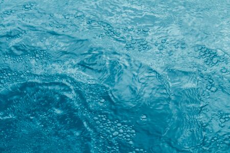 Beautiful pattern of blue water reflecting the sun.の写真素材