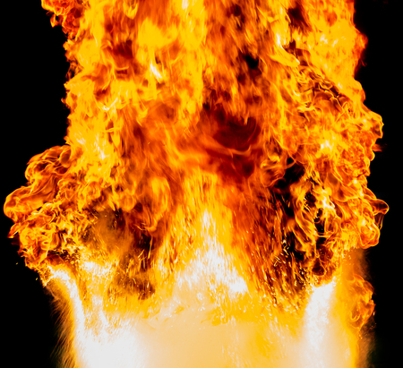 Flames rose above severe. Pour the water in oil on a pan and put in the fire burned.の写真素材
