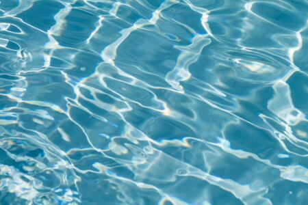 Beautiful pattern of blue water reflecting the sun.の写真素材