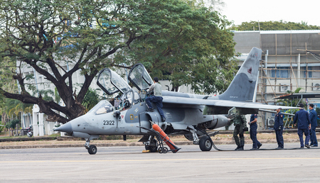 Udonthani - JAN 10: F-16 with soldier displayshow on children's Day at Udonthani Wing 23 Royal Thai Airforce Base located in Thailand, January 10, 2015, Udonthani, Thailandのeditorial素材
