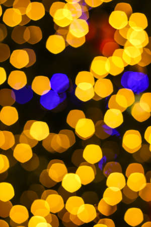 Abstract defocused bokeh lights background.If the focus of lens is on some positions. Bokeh is not round and was equal to the number of blades.の写真素材