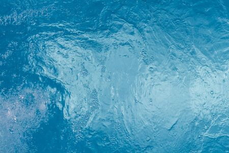 Beautiful pattern of blue water reflecting the sun.の写真素材