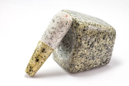 Mortar and pestle made of ancient stone pounding the ingredients or crushed herbs for medicine.の写真素材