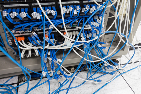 Local area network switch and un twice pair internet cables Disorganized Making it difficult to manage.の写真素材