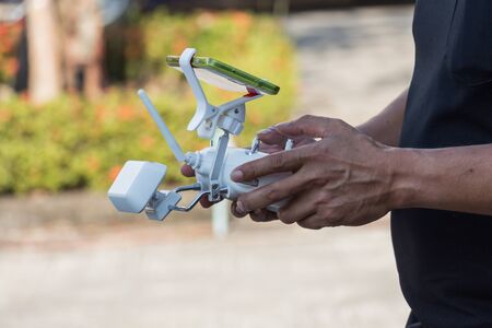 Controlling a remote helicopter drone with smartphone previewの写真素材