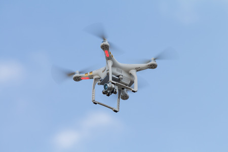 THAILAND UDONTHANI - Nov 10 , 2015 : Drone flying helicopter with camera in blue sky for top view .のeditorial素材