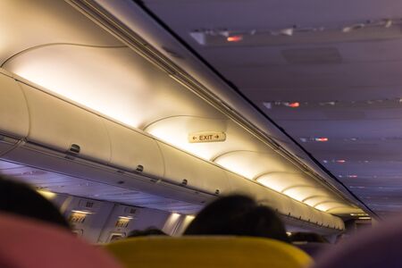 Emergency exit sign on the airplane.の写真素材