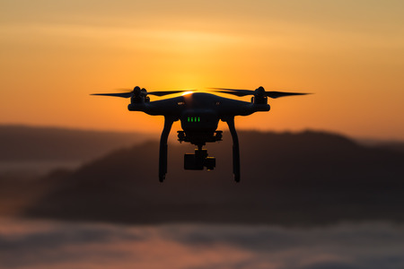 Flying helicopter with camera helping lost people  in the mountains.