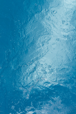 Beautiful pattern of blue water reflecting the sun.の写真素材