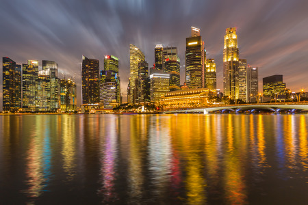High building and water reflection at twilight time.の写真素材