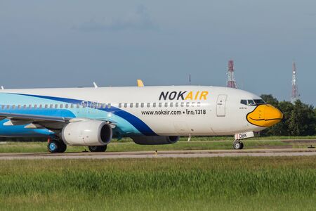 UDONTHANI, THAILAND - AUGUST 14, 2015:Air plane HS-DBK Boeing 737-800NG of Nok iar landing at Udonthani International Airport Thailand.の写真素材