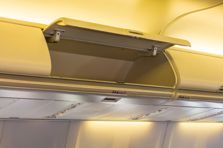 Overhead compartment in commercial aircraft.の写真素材