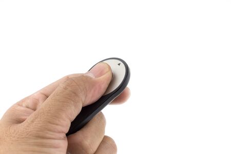Hand held camera remote control pointing forward on white background.の写真素材