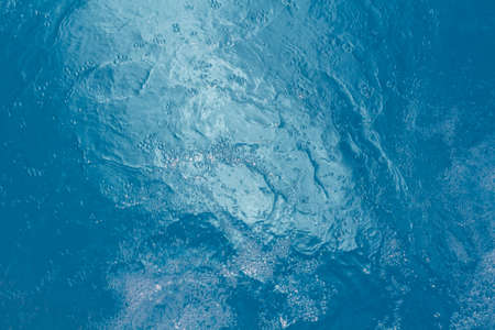 Beautiful pattern of blue water reflecting the sun.の写真素材