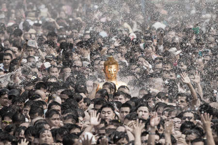 NONGKHAI THAILAND APRIL 13 , 2016 : Songkran Festival, Many people have raised the buddha statues Luang Pho Phra Sai joined parade to pray closely at Nongkhai Thailand.のeditorial素材