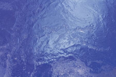 Beautiful pattern of blue water reflecting the sun.の写真素材