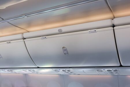 Overhead compartment in commercial aircraft.の写真素材