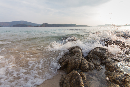 Sea splash on the rock on the beach.の写真素材