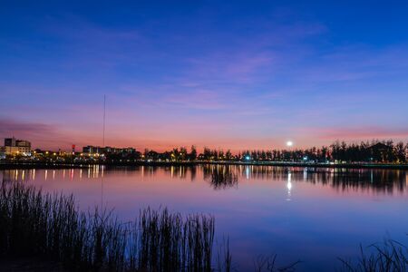 Beautiful lake and the city at twiligth time.の写真素材
