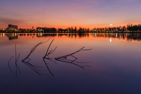 Beautiful lake and the city at twiligth time.の写真素材