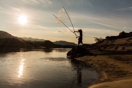 Fisherman use equipment for catch a fish.の写真素材
