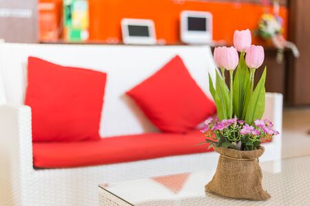 Plastic flower vase in the interior and instrument background.の写真素材