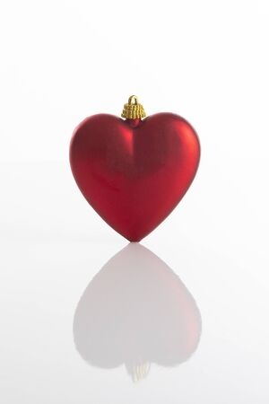 Red Christmas decoration with a heart shapeの写真素材