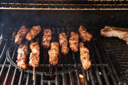 Grilled Pork Meat Kebab Skewers on a Professional Barbequeの写真素材